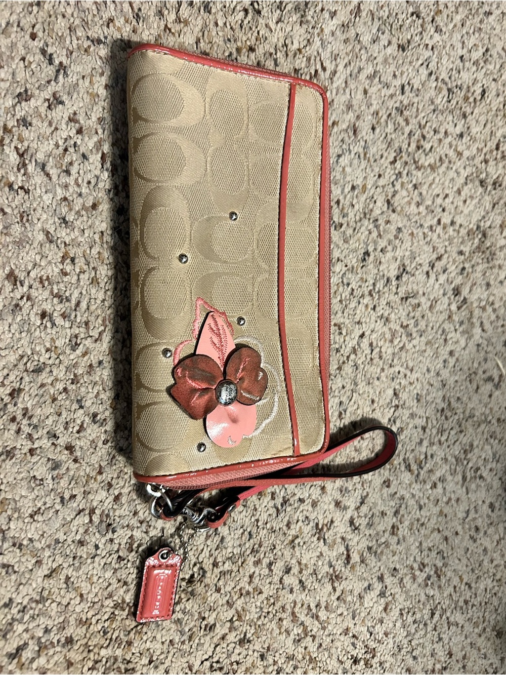 Coach Tan Signature Canvas Wristlet with Pink/Coral Trim & Floral Appliqué